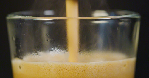 Close-up of strong espresso brewing at exclusive coffee machine