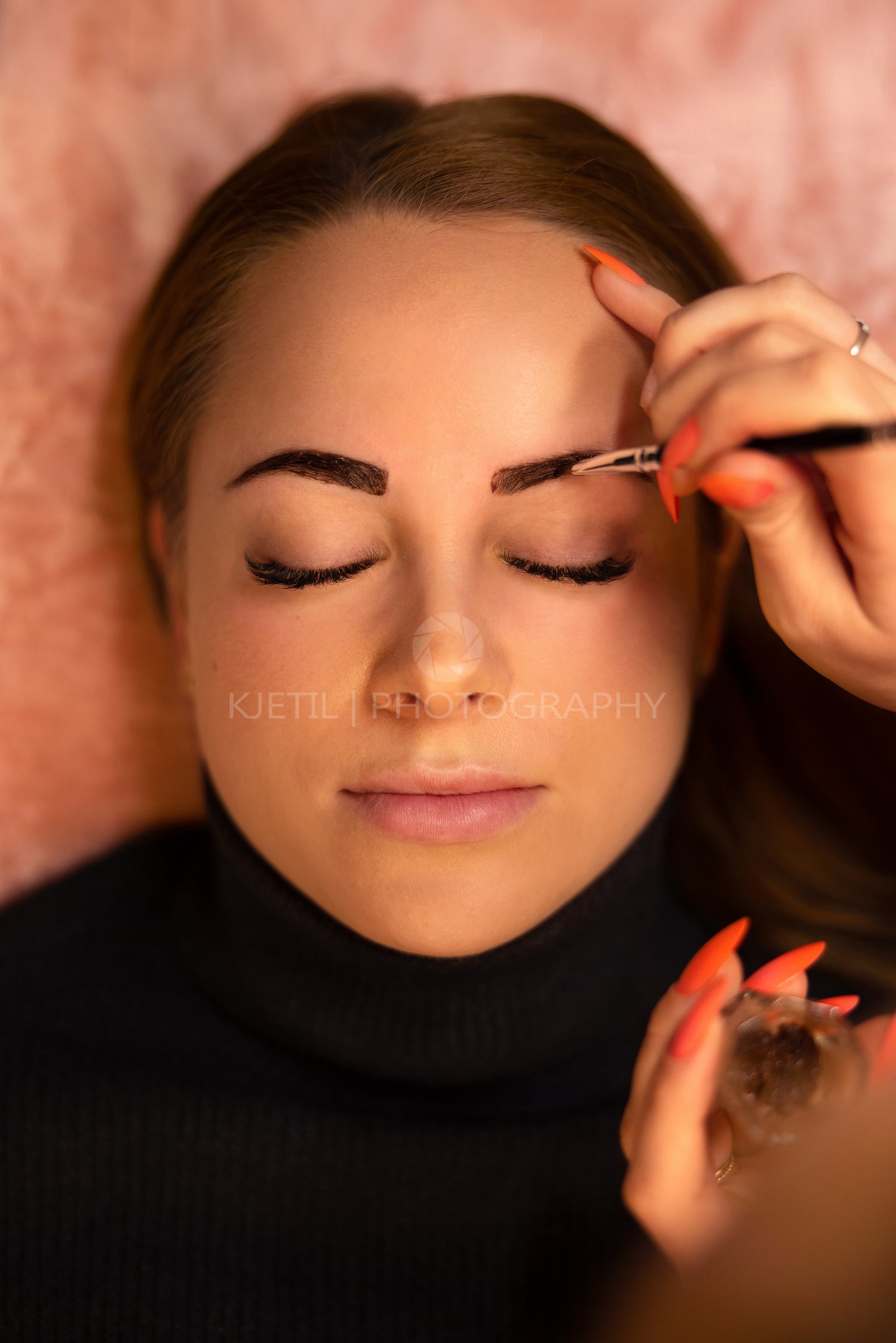 Beautician Applying Dye On Female Customer's Eyebrow