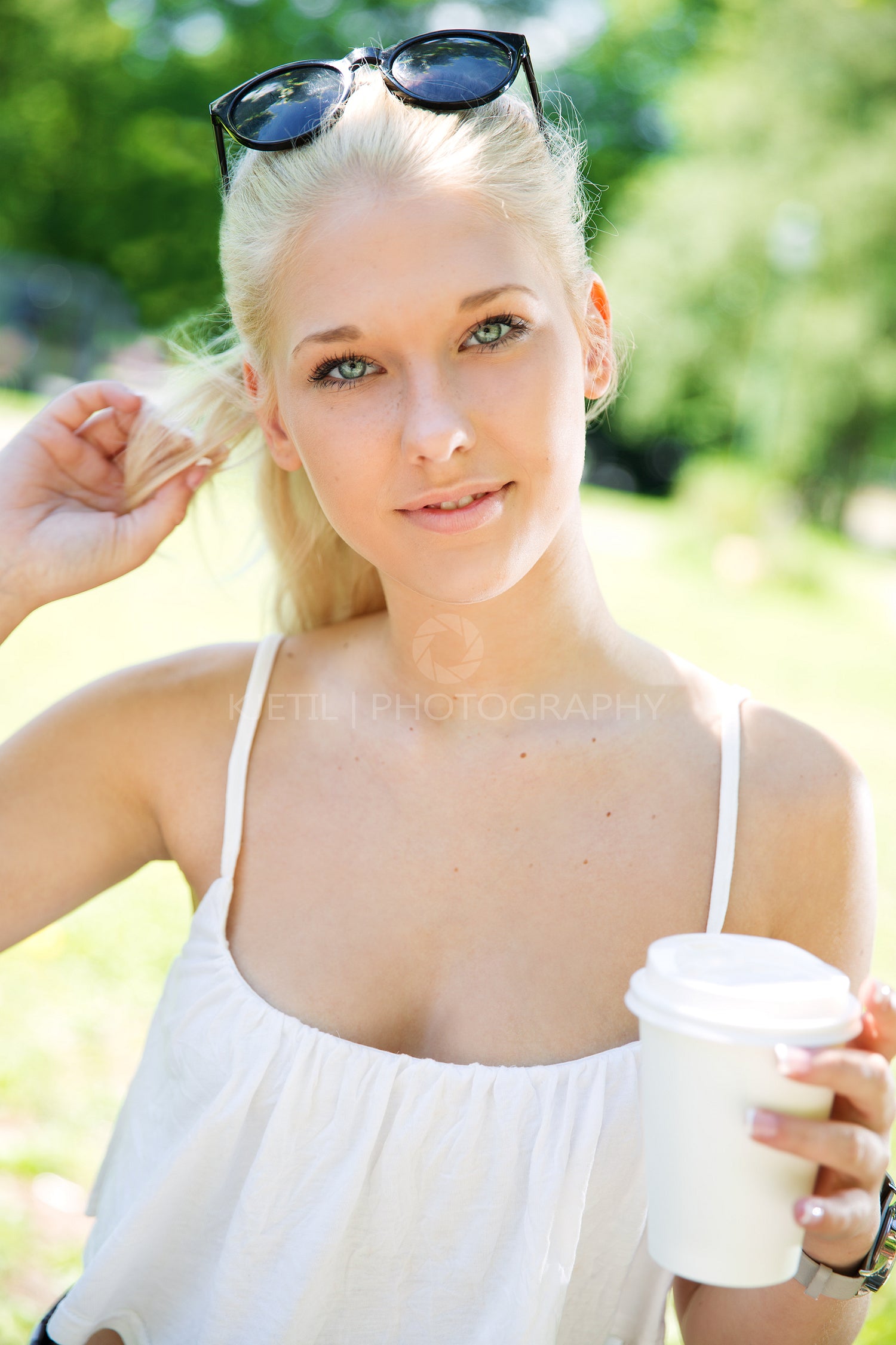 Beautiful teenage girl drinking coffee outdoor