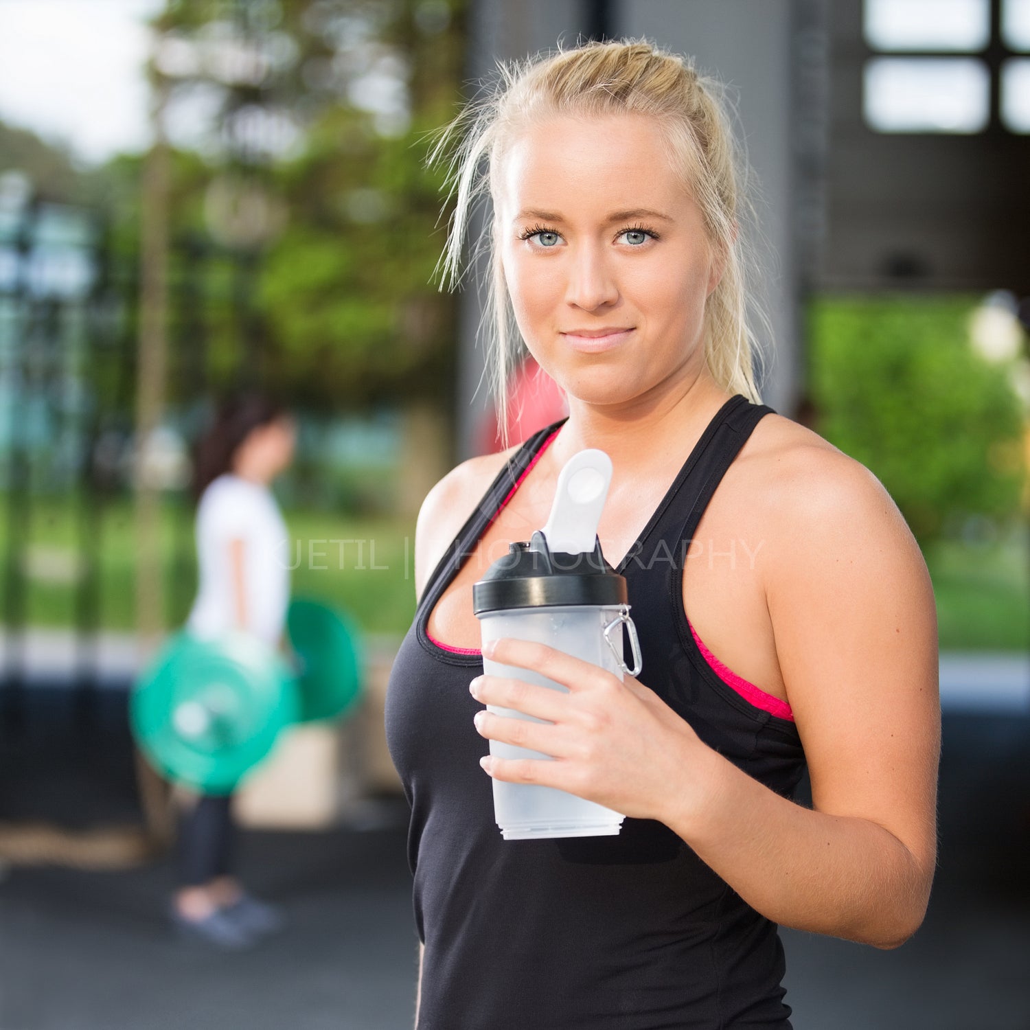 Woman rest and drinking water after workout