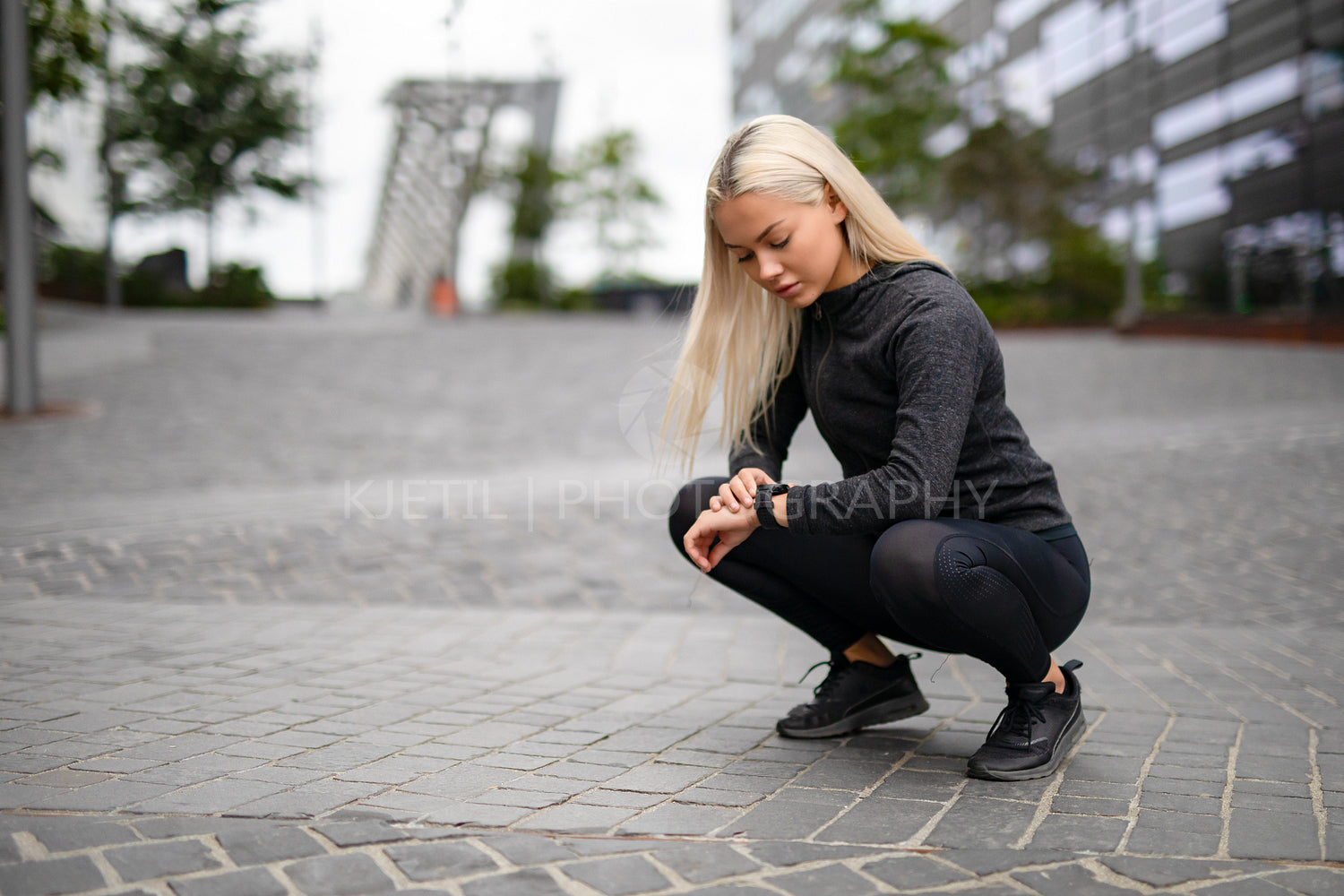 Sporty Female Runner Using Smartwatch to See Running Performance