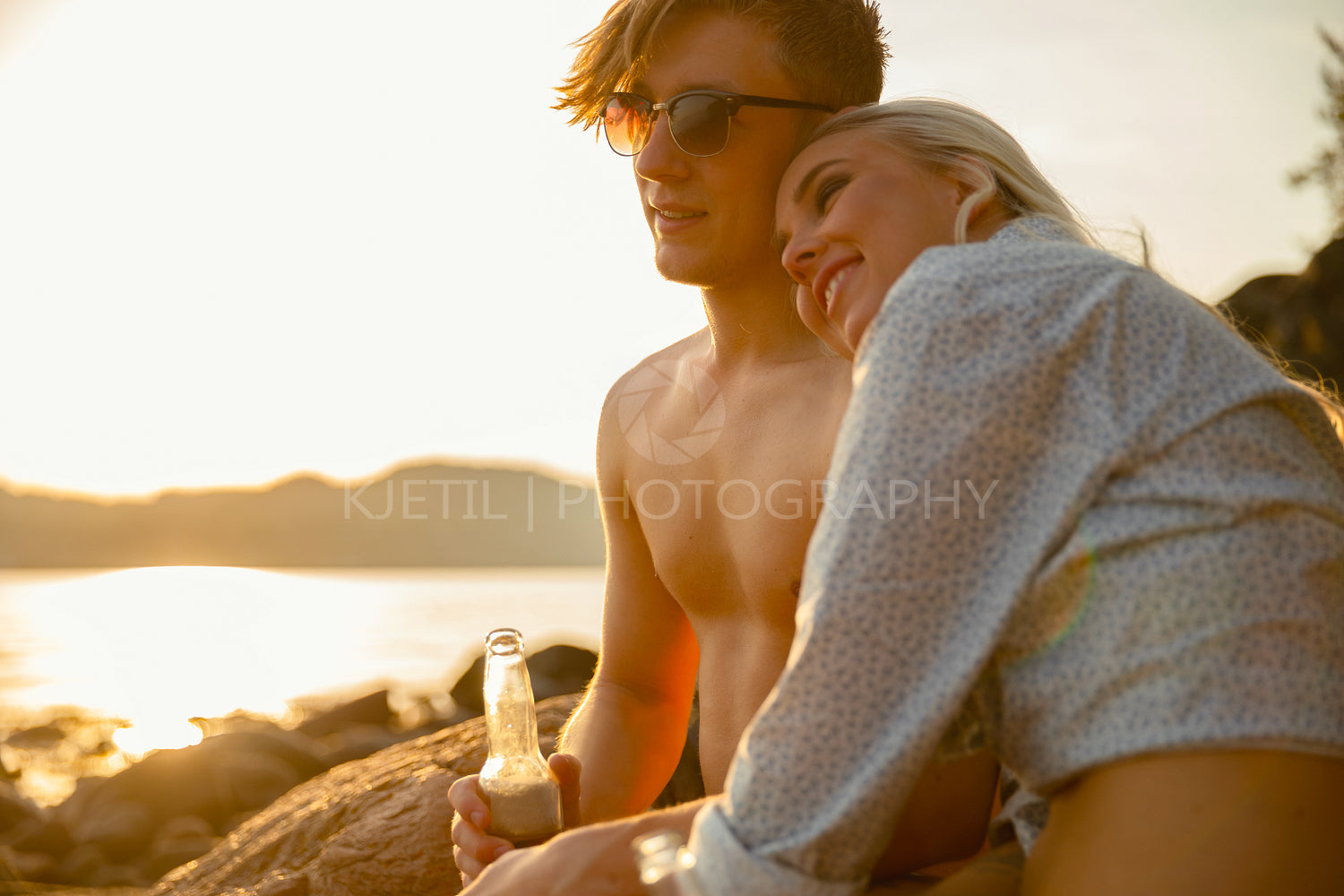 Happy Woman Sitting With Boyfriend At Beach