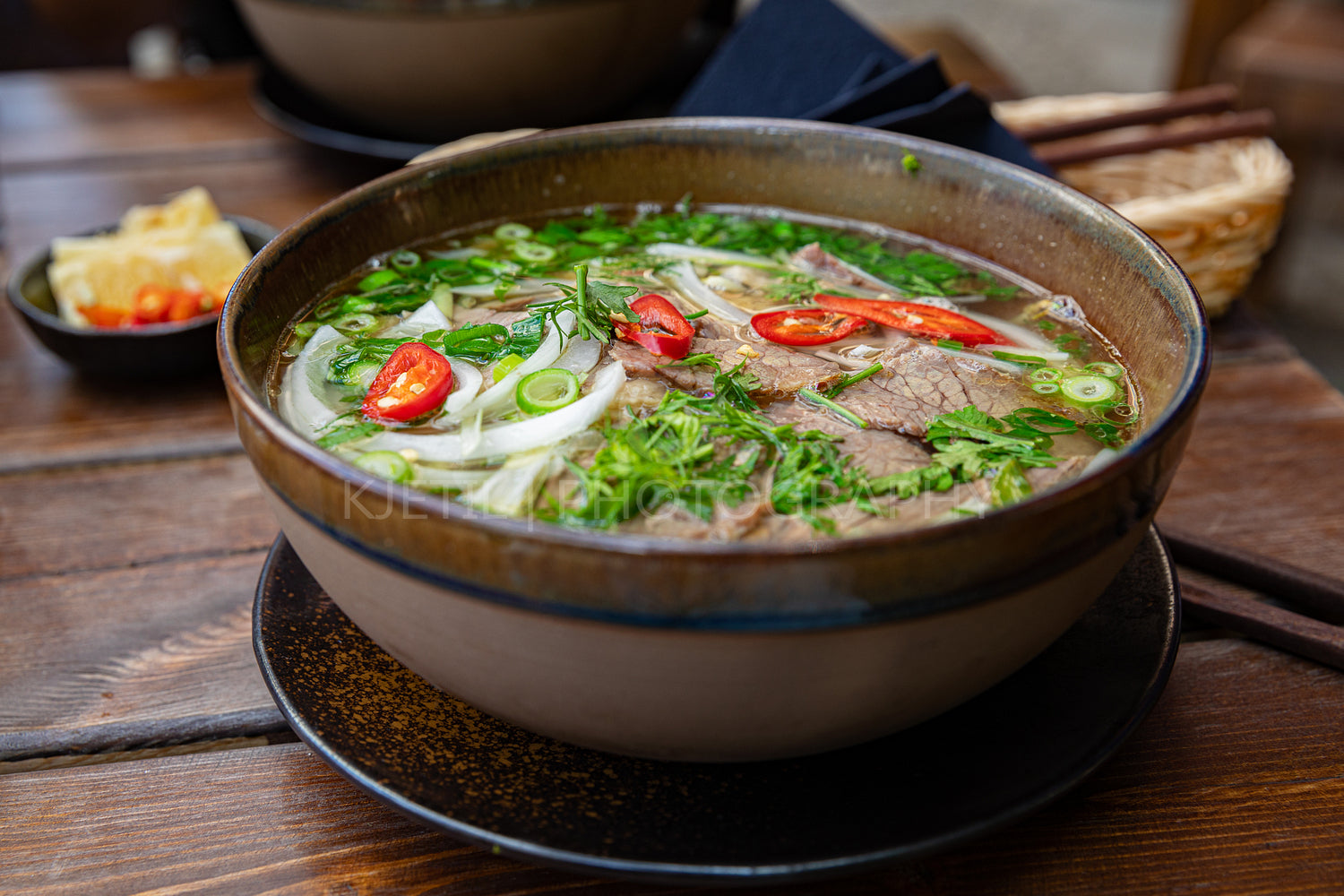 Close-up of fresh Pho soup in bowl served on table