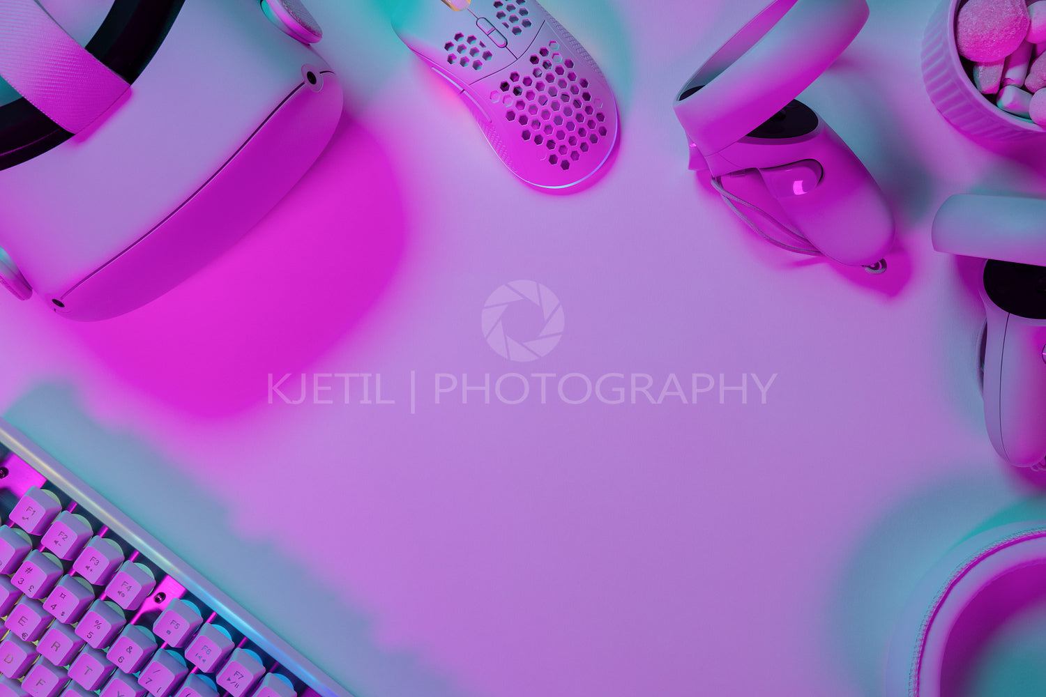 Modern gaming accessories on pink desk