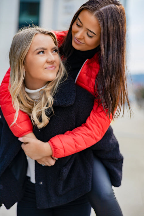 Close-up of Friend Having Fun and Piggybacking In City