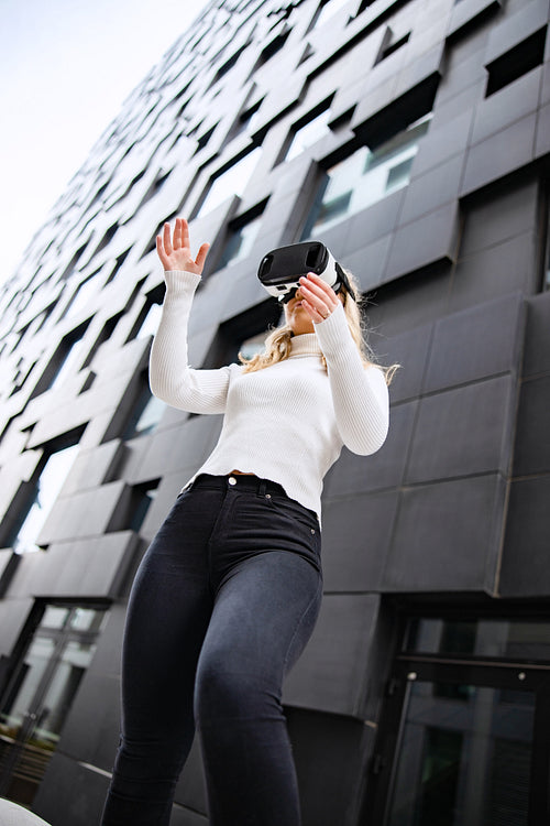 Woman Wearing Virtual Reality Glasses With Mordern City Background