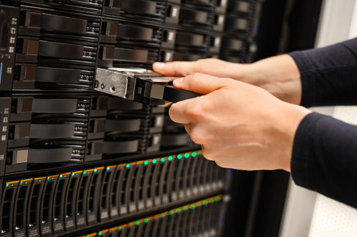 Male IT Technician Replacing Server Drive In San