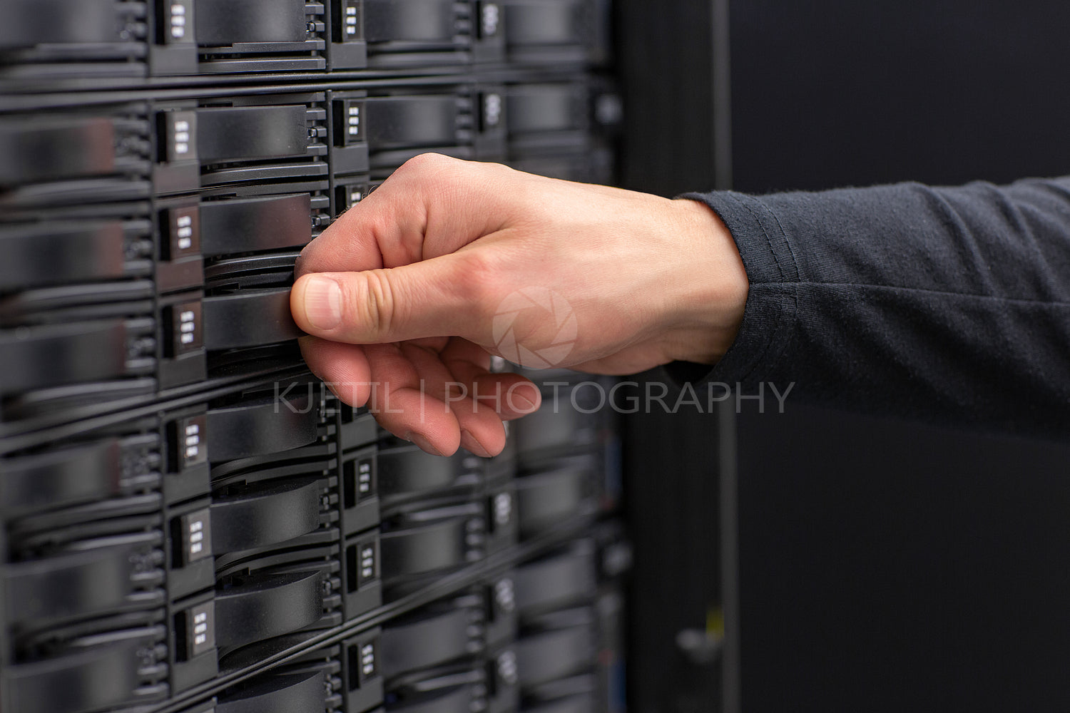 Close-up of IT Consultant Maintain SAN and Servers in Datacenter