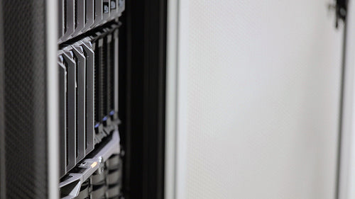 IT consultant removes blade server in datacenter