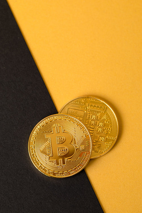Bitcoins Crypto Currency Coin On Gold And Black Background