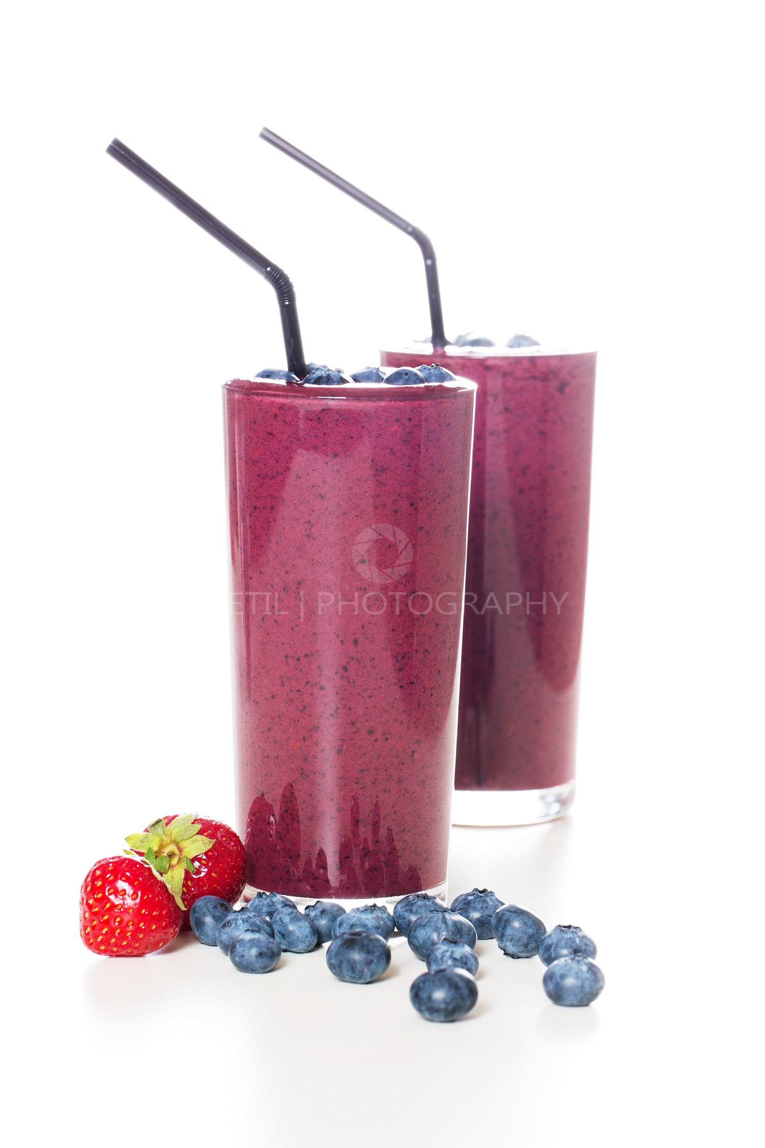 Two glasses of fresh organic berry smoothie
