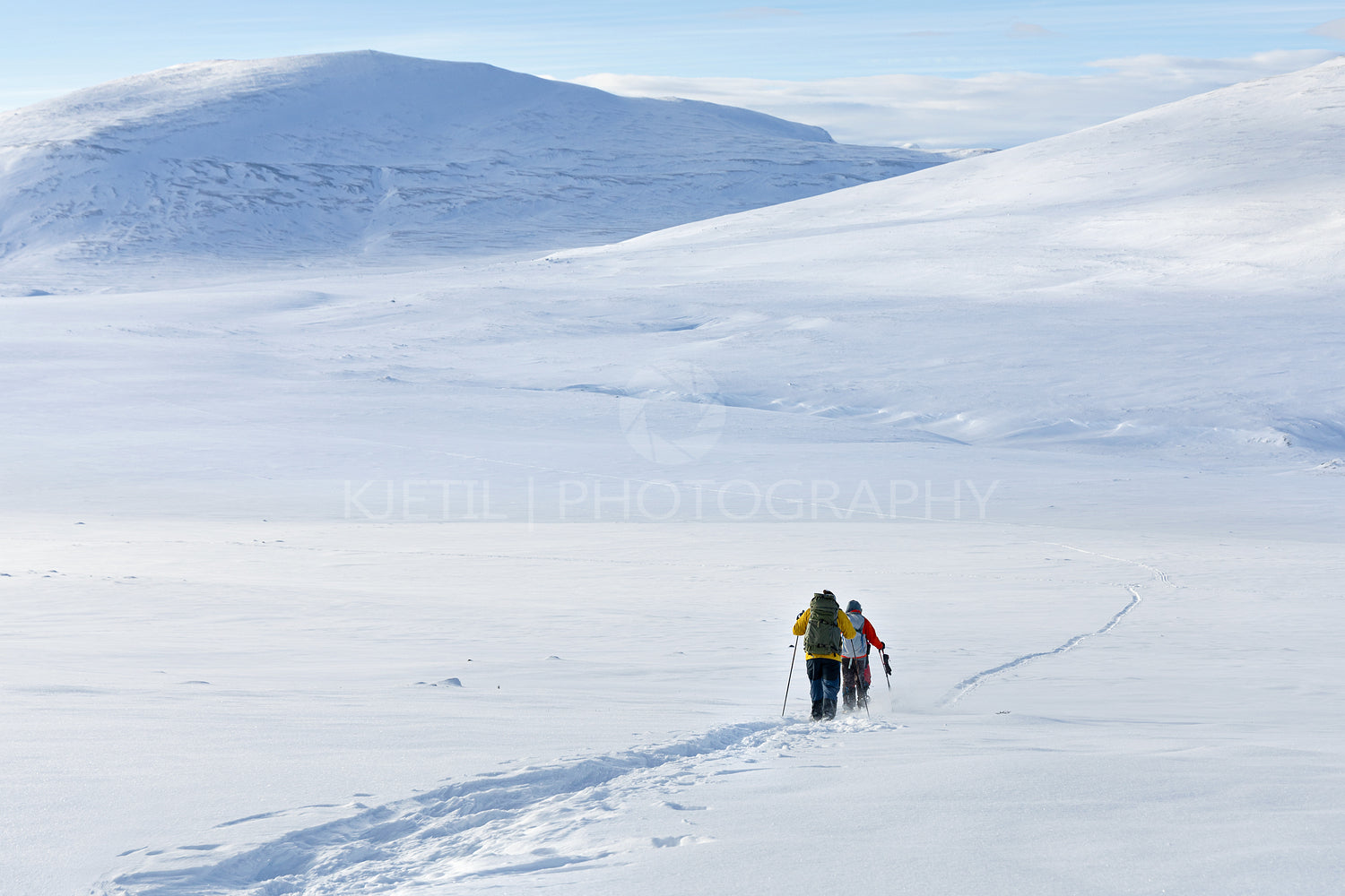 Hikers on snow shoe hiking on a beautiful sunny day at the mountain of Dovrefjell