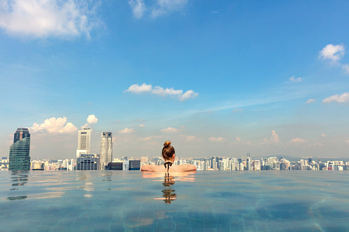 Female Tourist In Infinity Pool Of Marina Bay Singapore