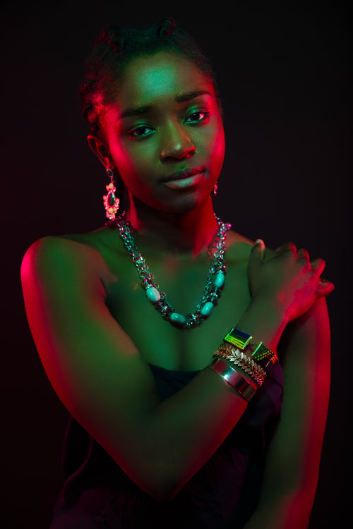 Multi color portrait of confident african woman wearing jewelry