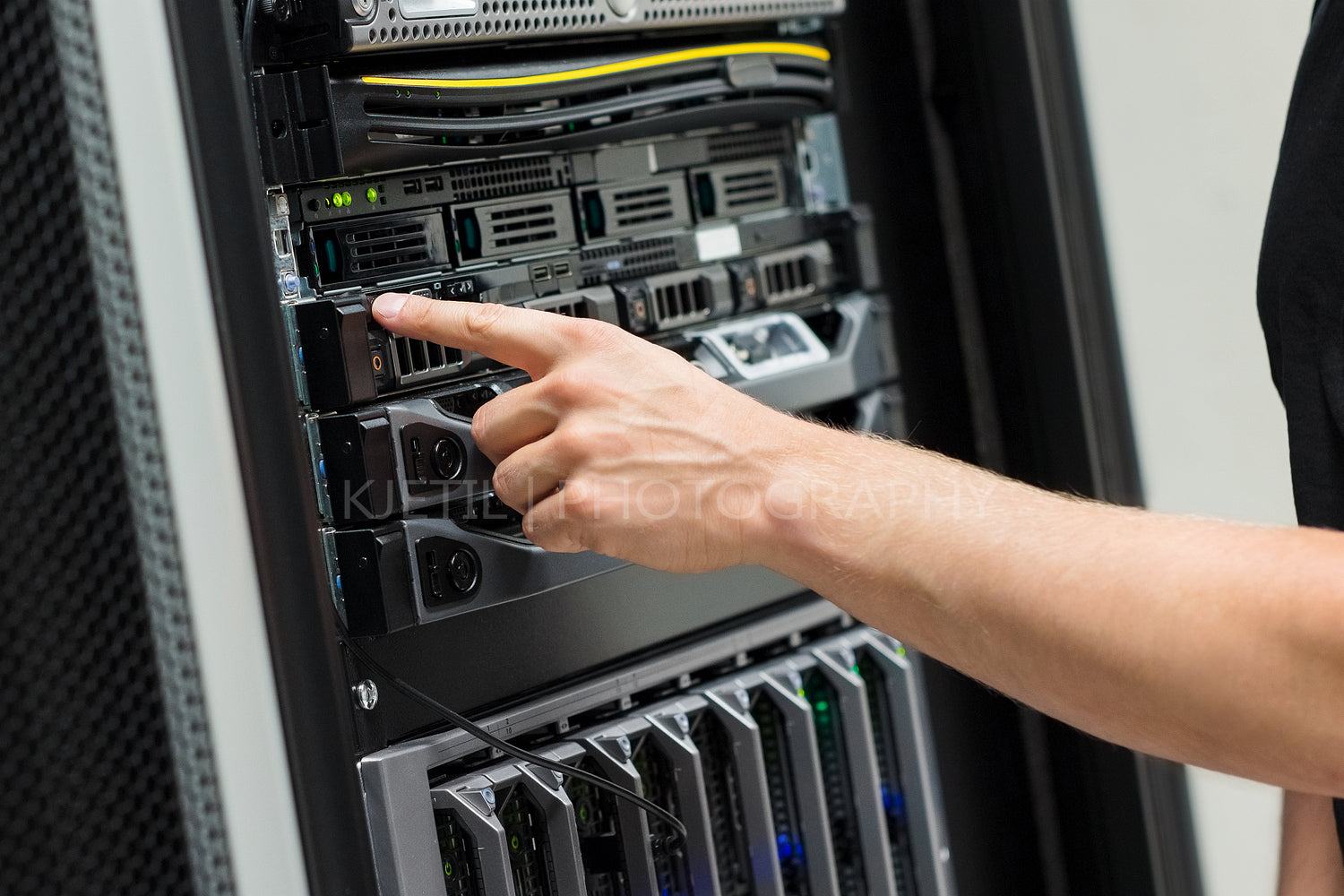 Close-up of IT Engineer Switching On Server At Datacenter