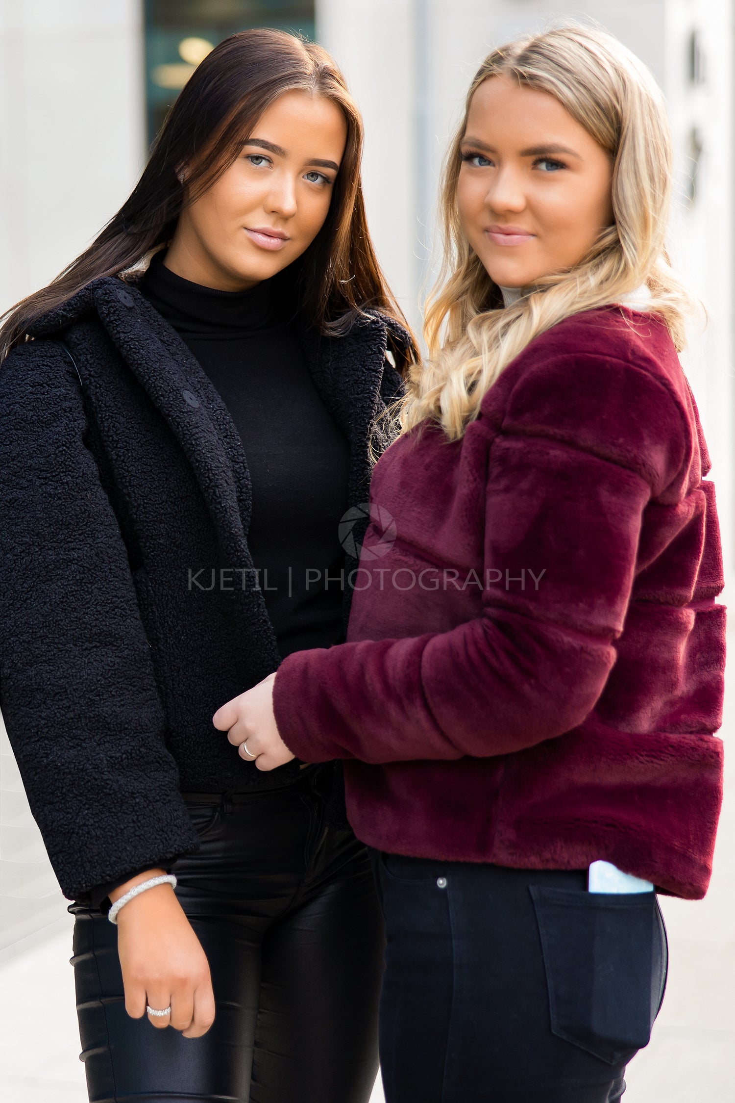 Portrait Of Two Smiling Beautiful Young Women Friends In City