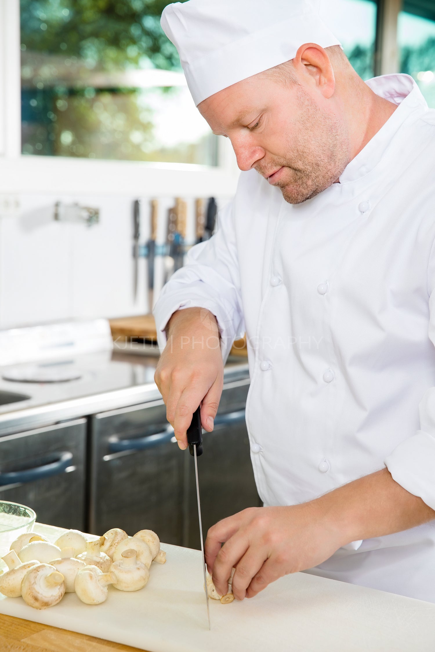 Professional chef preparing vegetables to a healthy dish