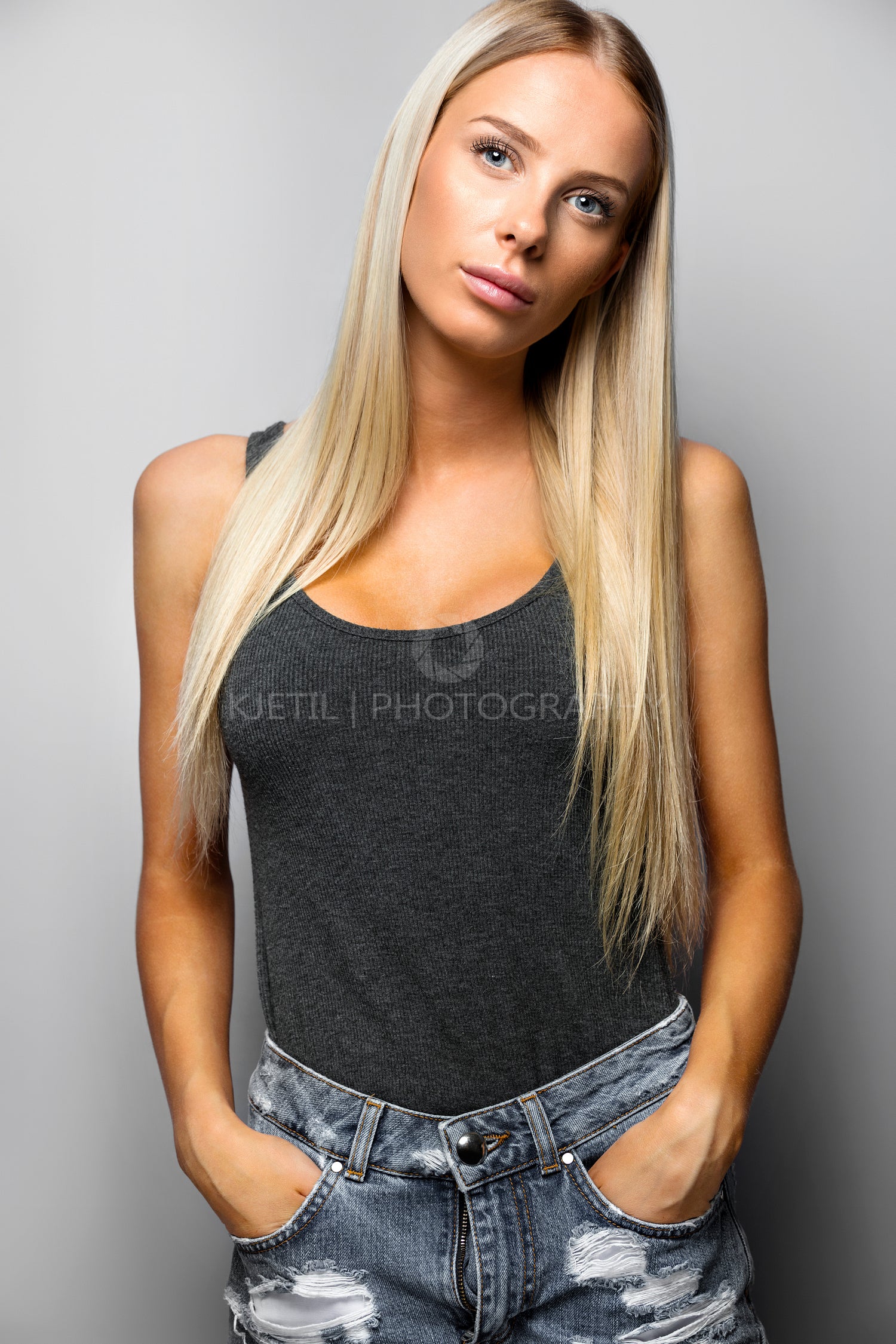 Confident Woman In Casuals Standing Over Gray Background