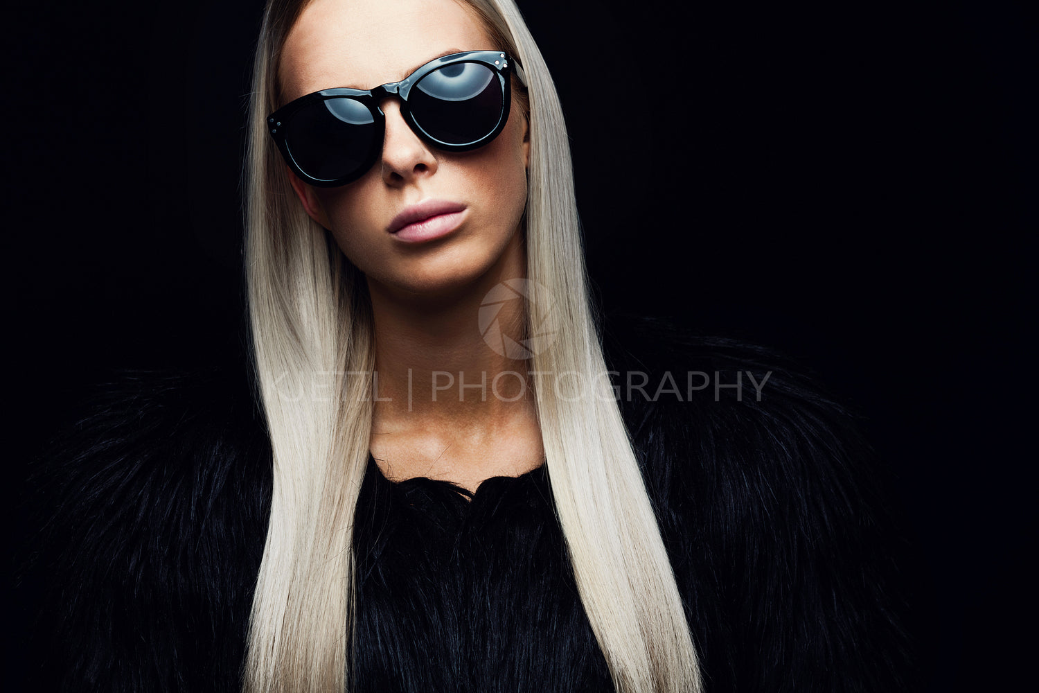 Fashion woman with hairy jacket and sunglasses