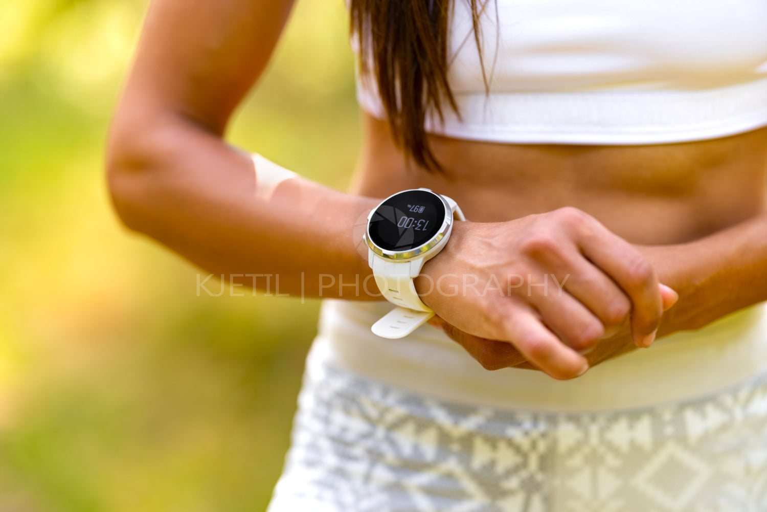 Close-up of woman using fitness smart watch device under workout