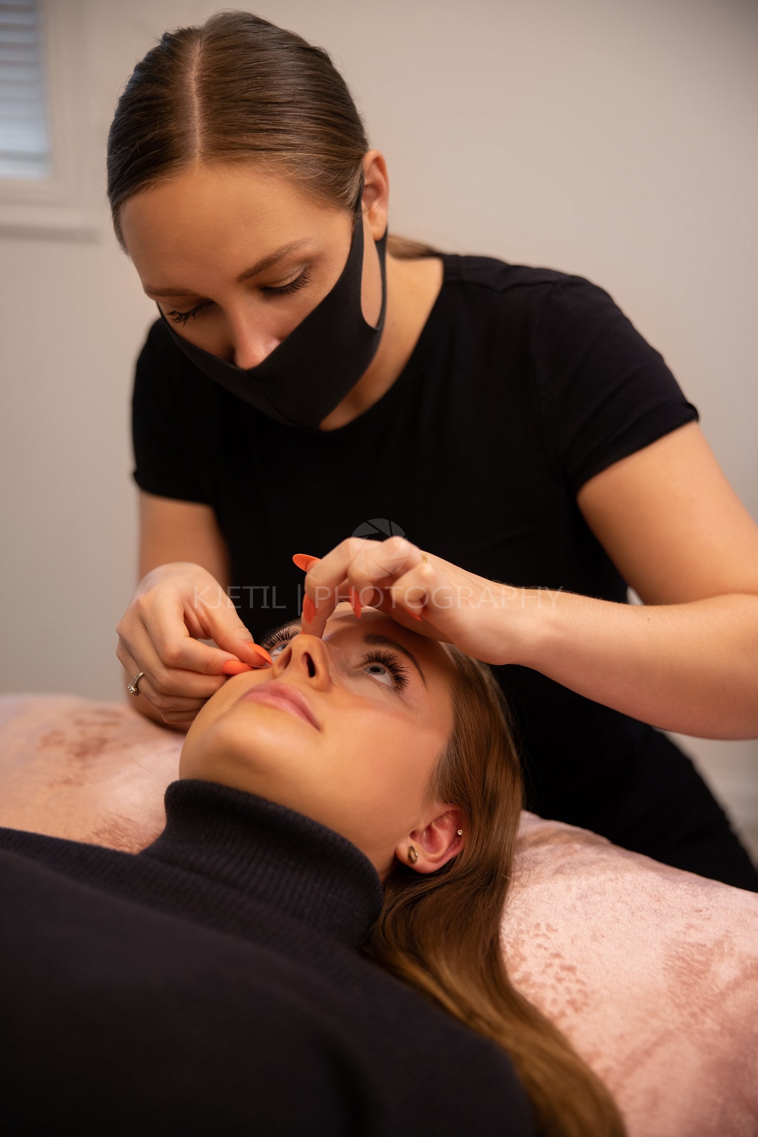 Cosmetologist Treating Female Customer For Eyelash Extension