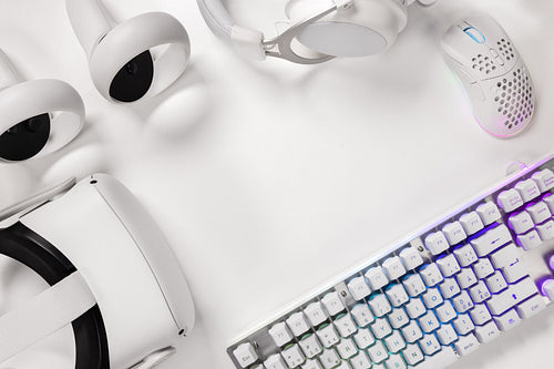 Keyboard with gaming gadgets on white desk