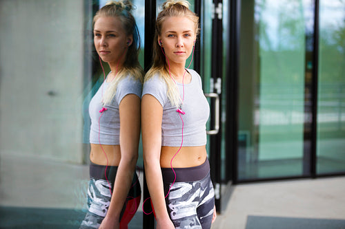 Portrait of attractive woman in workout outfit in the city