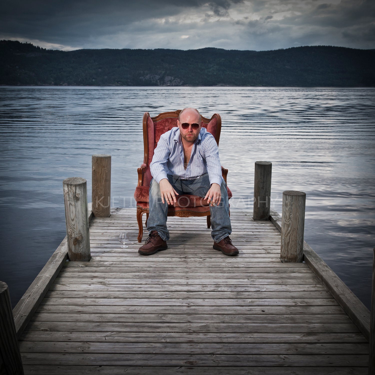 Man in Chair on a Pier