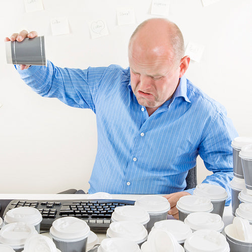 No more coffee for exhausted businessman