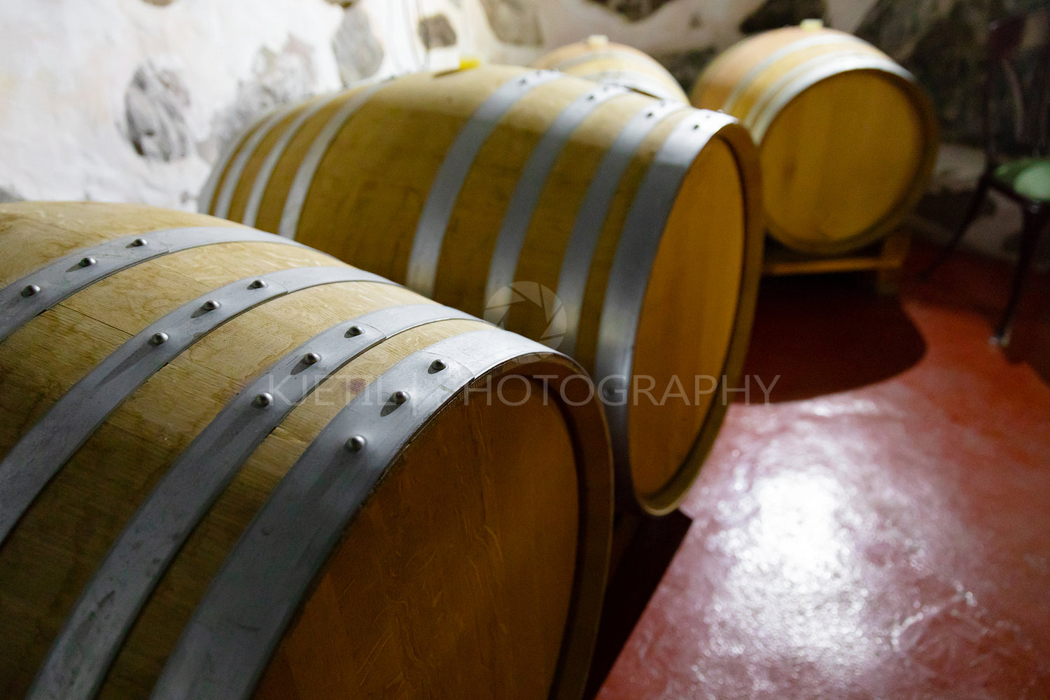 Wooden Barrels At Wine Storeroom in Dark Cellar
