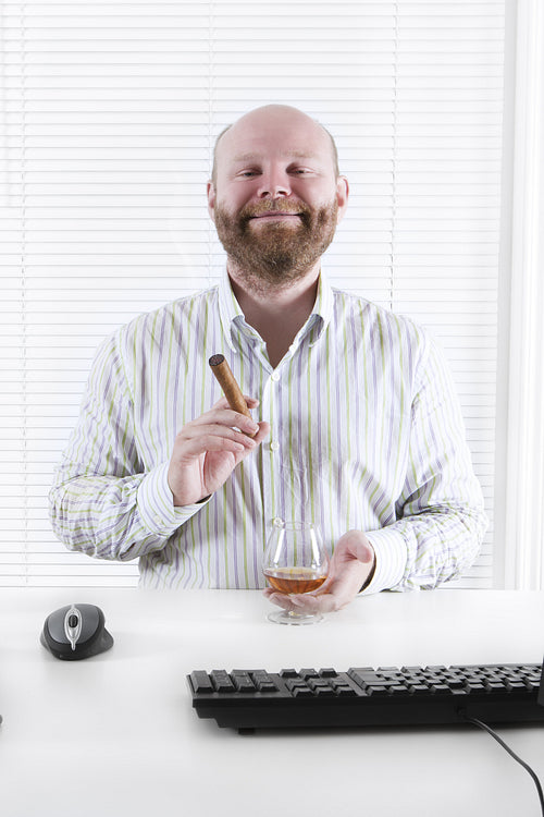 Businessman Celebrate with Cognac and Cigar