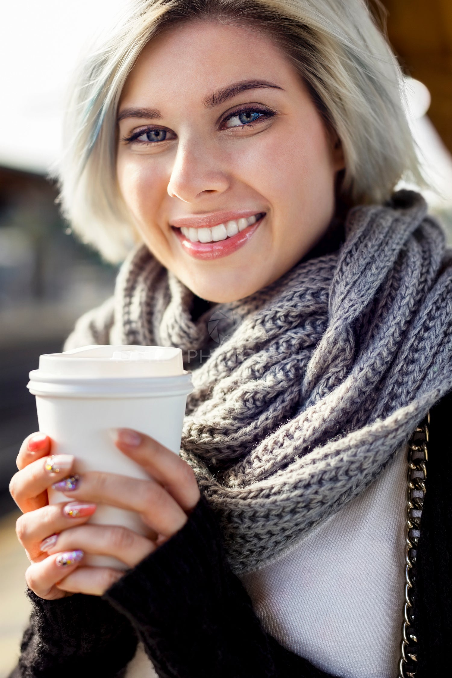 Happy Woman Holding Disposable Coffee Cup At Train Station