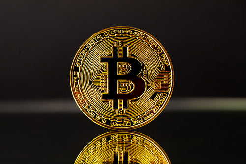 Gold Bitcoin With Reflection On Black Background