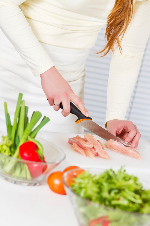 Woman Chop Chicken Fillet