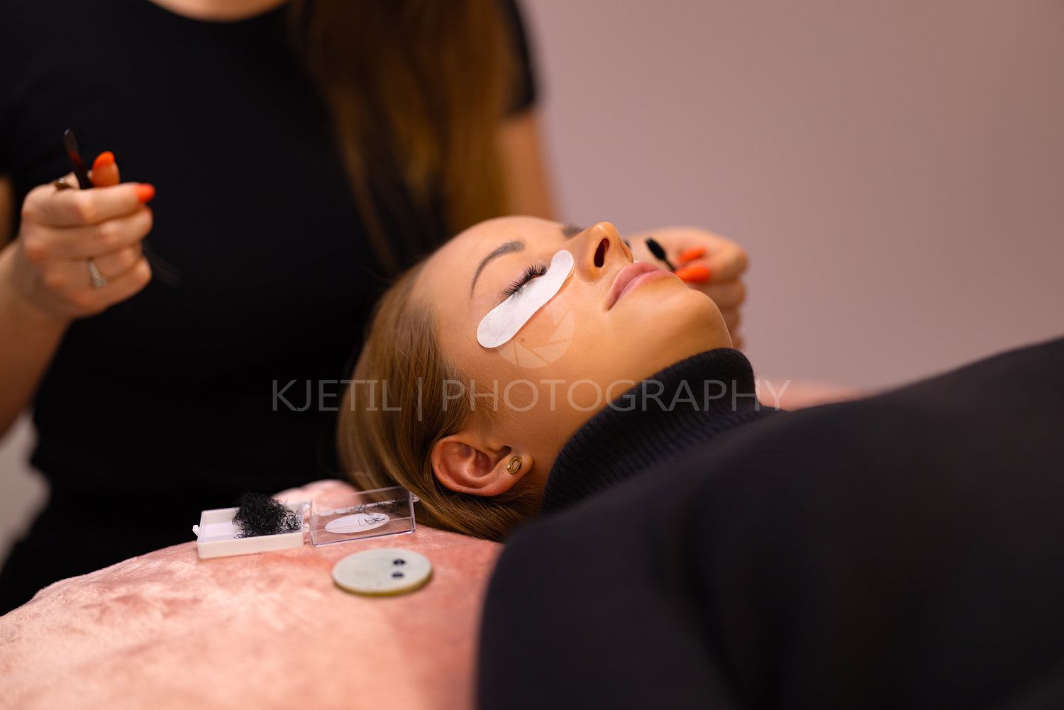 Woman Going Through Eyelash Extension Treatment At Beauty Clinic