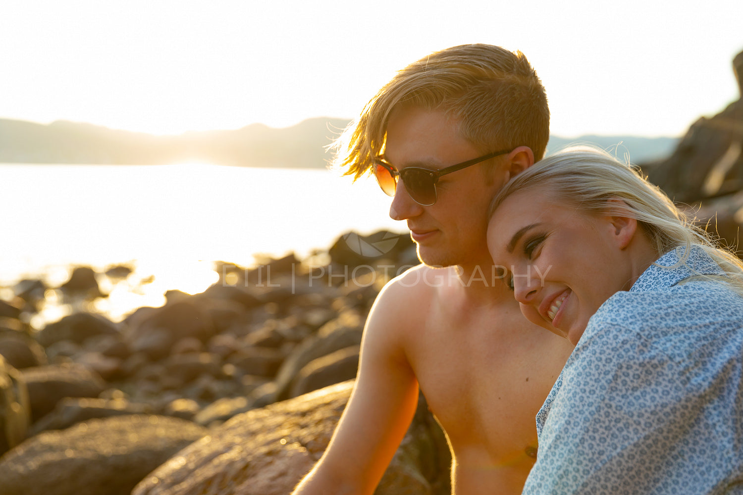 Couple in love enjoy the sunset at the beach