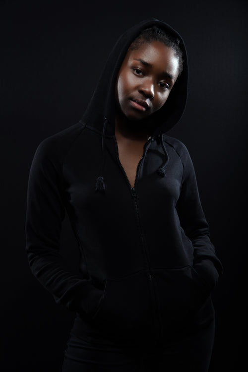 Cool and chill woman with dark skin and attitude wearing hoodie