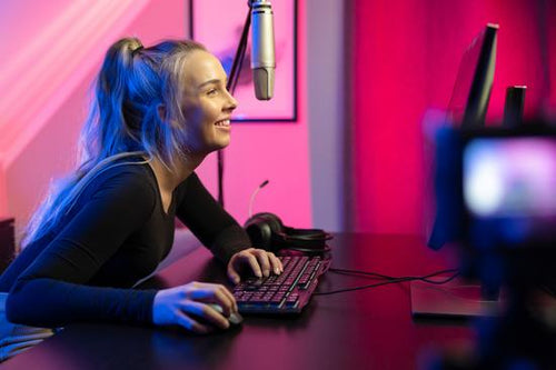 Professional esport gamer girl streaming vlog and plays online video game on PC