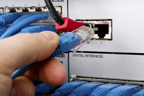 Engineer Connecting Telecom Cable