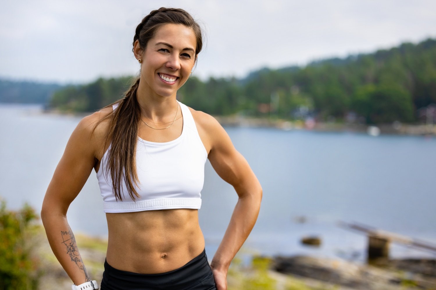 Confident Fit Woman Standing With Hands On Hip